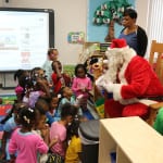 Santa handing out gifts as all the kids waited patiently and with full excitement. 150x150 Potter Elementary School